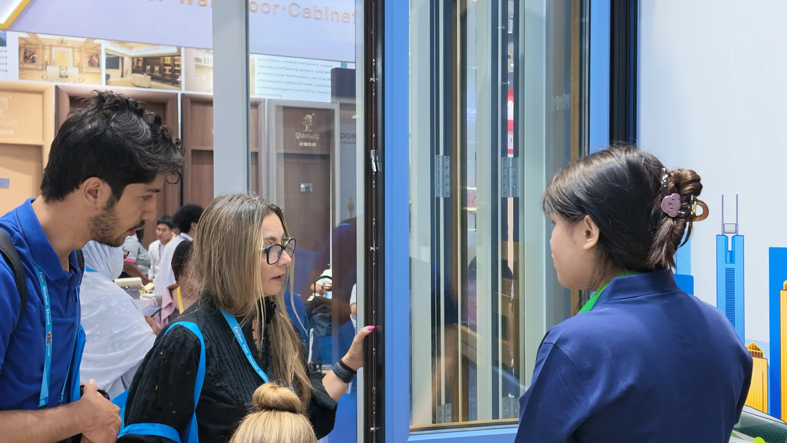 Door Sample Demonstration in April 2026 Visitors viewing a door sample with the Rogenilan team in April 2026